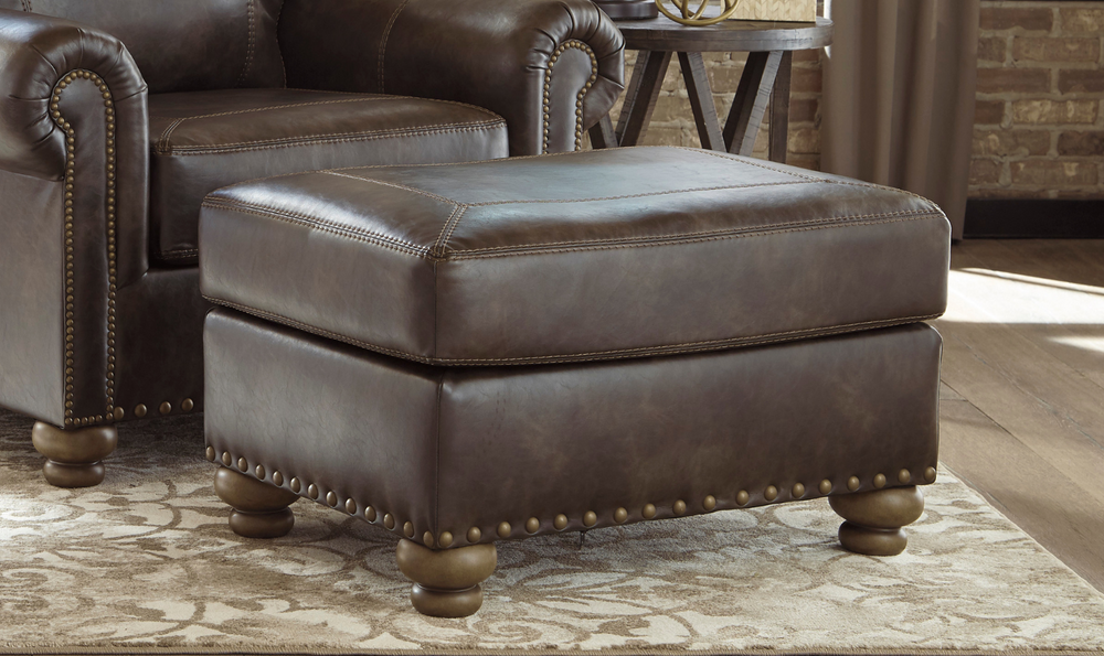 Ashley Nicorvo Firmly Cushioned Leather Ottoman in Coffee-Leahyco