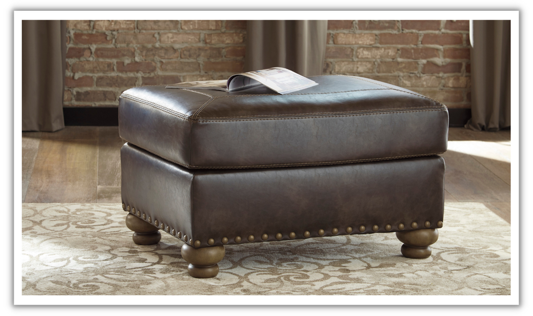 Ashley Nicorvo Firmly Cushioned Leather Ottoman in Coffee-Leahyco